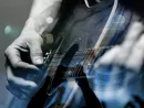 country artist/Guitarist with the audience in a double exposure