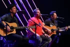 Joe Don Rooney^ Gary LeVox and Jay DeMarcus (L-R) of Rascal Flatts perform at CBS Radio's Stars & Stripes event at the Chicago Theatre on November 9^ 2016 in Chicago^ Illinois.