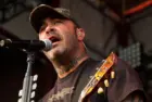 Aaron Lewis plays his guitar druing the performance of Staind Rockstar Uproar Festival on September 25^ 2012 in Nampa^ Idaho.