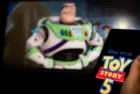 New Disney film Toy Story 5. A man's hand holds a phone with a poster of the new cartoon Toy Story 5 by Pixar. Moscow November 2025.