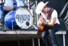 Dustin Lynch performs during the 'Kick The Dust Up' Tour at Vanderbilt Stadium on July 11^ 2015 in Nashville^ Tennessee.