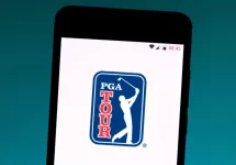 photo illustration the PGA Tour logo is displayed on a smartphone.