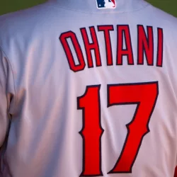 Shohei Ohtani of the Los Angeles Angels in the dugout at the Oakland Coliseum. Oakland^ California - August 10^ 2022