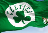 Boston Celtics flag^ waving in the wind on a clear day. American professional basketball team^ Eastern Conference