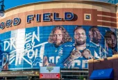 Horizontal^ medium closeup of "Ford Field" Detroit Lions' football field stadium's exterior facade brand and logo signage on a sunny day. Detroit^ MI USA - September 15^ 2021