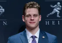 Quarterback Joe Burrow of the LSU Tigers winner of the 85th annual Heisman Memorial Trophy poses with trophy at the Marriott Marquis Hotel New York^ NY - December 14^ 2019