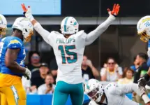 Miami Dolphins linebacker Jaelan Phillips (15) celebrates after an interception against the Los Angeles Chargers during an NFL football game^ Sept. 10^ 2023^ in Inglewood^ Calif.
