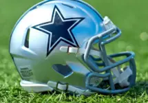 NFL Dallas Cowboys replica helmet on artificial grass playing turf ^ product shot