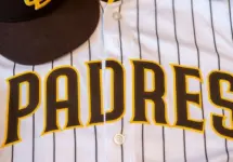 San Diego Padres baseball hat and team jersey.