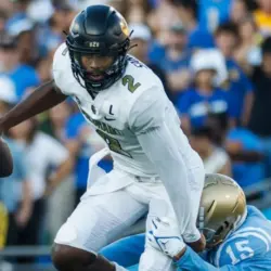 Colorado quarterback Shedeur Sanders #2 is tackled by UCLA defensive line Laiatu Latu #15 during an NCAA college football game between the UCLA and the Colorado^ Oct. 28^ 2023^ in Pasadena^ Calif.