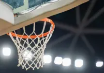 Basketball hoop hanging in a sports stadium waiting for the ball