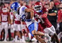 NCAA Football^ BYU 38:31 Ark- Cougars WR Parker Kingston (82) catches a pass fights off Razorbacks DB Lorando Johnson (1) the game at Razorback Stadium^ Fayetteville^ AR. Sept 16^ 2023