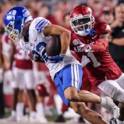 NCAA Football^ BYU 38:31 Ark- Cougars WR Parker Kingston (82) catches a pass fights off Razorbacks DB Lorando Johnson (1) the game at Razorback Stadium^ Fayetteville^ AR. Sept 16^ 2023