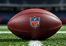 Outdoor photo of nfl ball in the middle of the football field