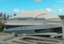 Aerial shot of LoanDepot Park with skyscrapers and office buildings in the city skyline^ lush green palm trees and cars on the street in Miami Florida USA Miami Florida USA - 11 -12-2024