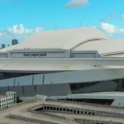 Aerial shot of LoanDepot Park with skyscrapers and office buildings in the city skyline^ lush green palm trees and cars on the street in Miami Florida USA Miami Florida USA - 11 -12-2024