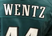 A fan wears the jersey of injured Eagles quarterback Carson Wentz in a mall. Minneapolis^ MN/USA- February 1^ 2018