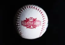 Close up baseball printed with logo for the 2015 Major League Baseball All-Star Game isolated on a dark black background. Cincinnati^ Ohio^ USA - July 21 2022