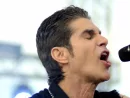 singer Perry Farrell performs at an outdoor concert in Indiana.