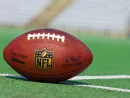 NFL football on grass turf background