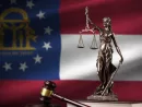 Georgia US state flag with statue of lady justice^ constitution and judge hammer on black drapery