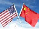 American and Chinese flags on cloudy sky. waving in the sky