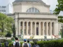 Students at the Columbia University campus on the Upper West Side of Manhattan. Steps of the Low Memorial Library in the background. New York^ NY^ USA - July 8^ 2022: