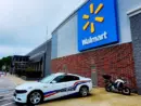 Police car parked in front of Walmart Store^ Fayetteville^ North Carolina^ USA^ August 6^ 2025