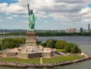 New York City with statue of liberty photo from drone. Aerial view of statue of liberty skyline in Manhattan. NYC^ NY. Cityscape near statue of liberty. Famous statue of liberty of New York.