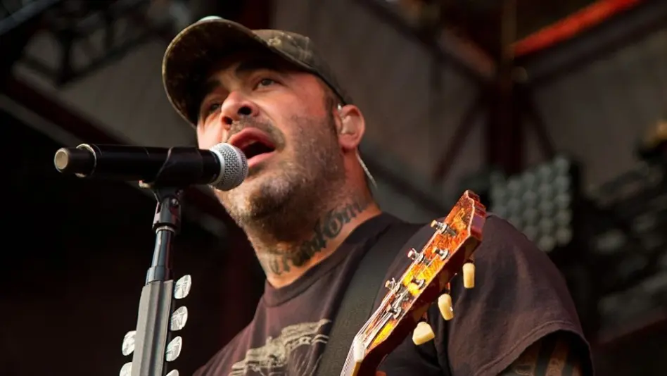 Aaron Lewis plays his guitar druing the performance of Staind Rockstar Uproar Festival on September 25^ 2012 in Nampa^ Idaho.