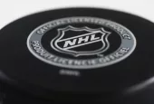 Officiel licensed hockey puck for NHL^ National hockey league.