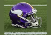NFL's Minnesota Vikings helmet placed on football field - AI GENERATED IMAGE