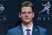 Quarterback Joe Burrow of the LSU Tigers winner of the 85th annual Heisman Memorial Trophy poses with trophy at the Marriott Marquis Hotel New York^ NY - December 14^ 2019