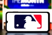 Selective focus of the MLB (Major League Baseball) logo. It is the premier professional baseball league in North America