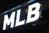 MLB (Major League Baseball) brand logo store sign close up