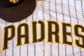 San Diego Padres baseball hat and team jersey.