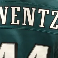 A fan wears the jersey of injured Eagles quarterback Carson Wentz in a mall. Minneapolis^ MN/USA- February 1^ 2018