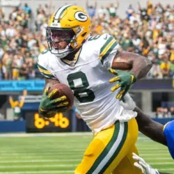 Green Bay Packers running back Josh Jacobs #8 runs past Los Angeles Rams outside linebacker Jared Verse #8 for a touchdown during an NFL football game at SoFi Stadium^ Sunday^ Oct. 6^ 2024.