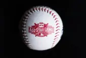 Close up baseball printed with logo for the 2015 Major League Baseball All-Star Game isolated on a dark black background. Cincinnati^ Ohio^ USA - July 21 2022