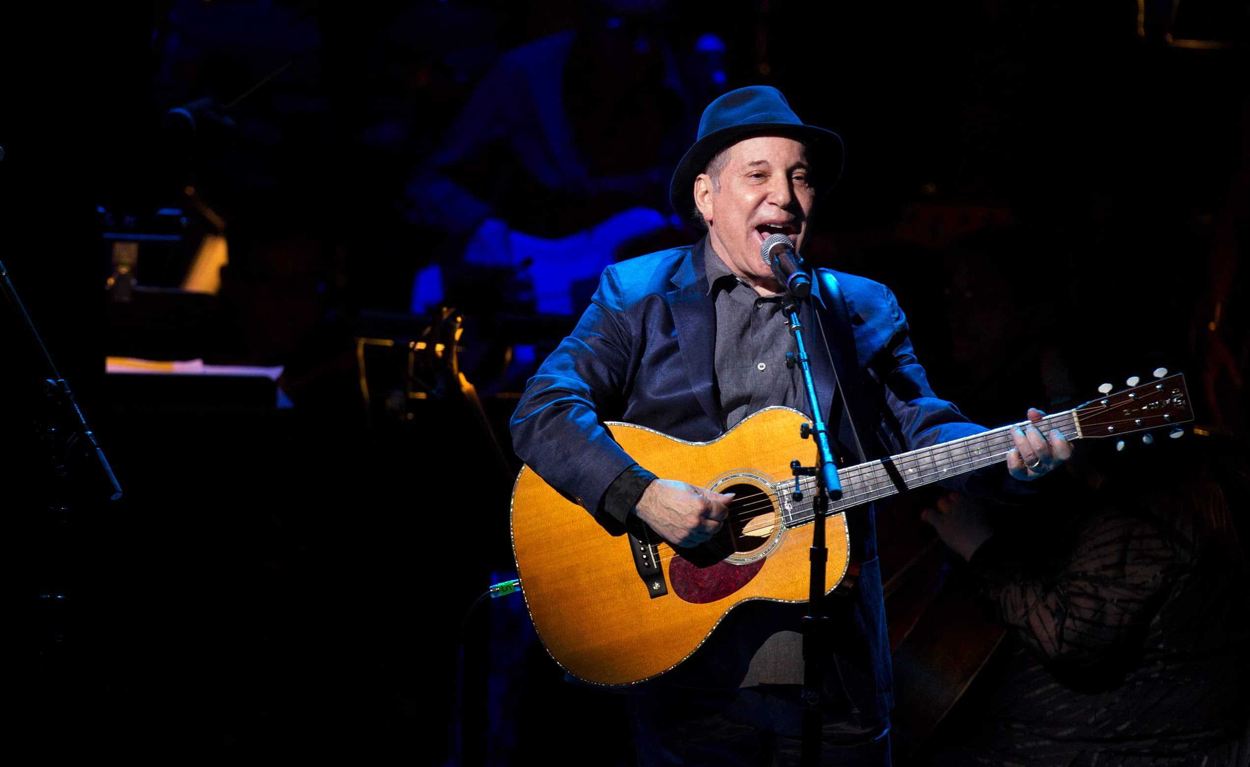 singer-paul-simon-performs-with-sting-during-the-rainforest-funds-25th-anniversary-benefit-concert-in-new-york