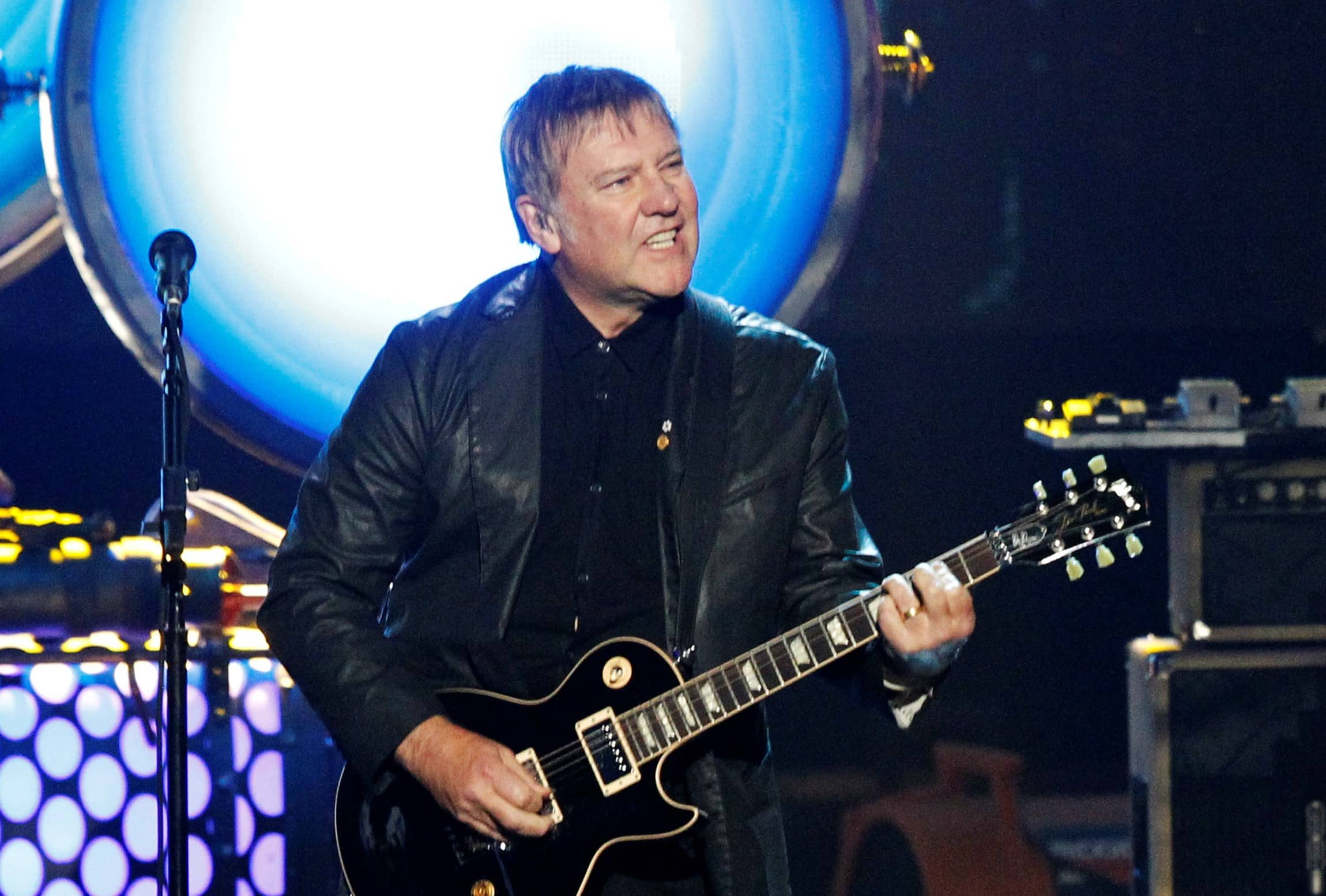 alex-lifeson-of-rush-performs-during-his-bands-induction-at-the-2013-rock-and-roll-hall-of-fame-induction-ceremony-in-los-angeles-2