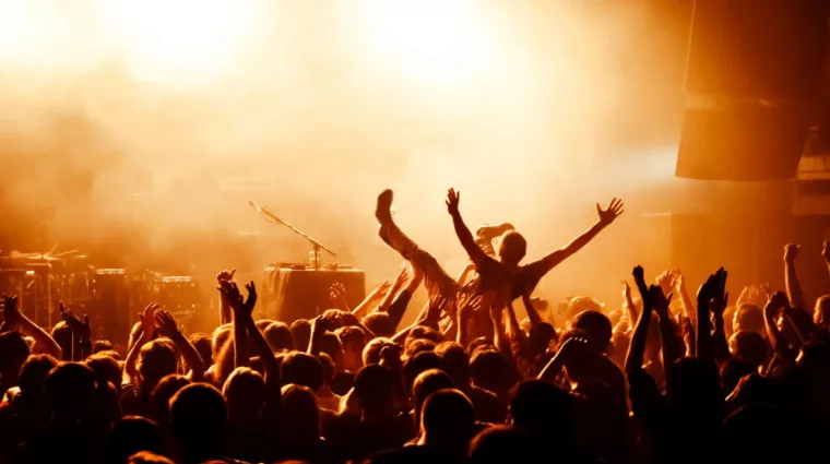 Crowd surfing during a musical performance