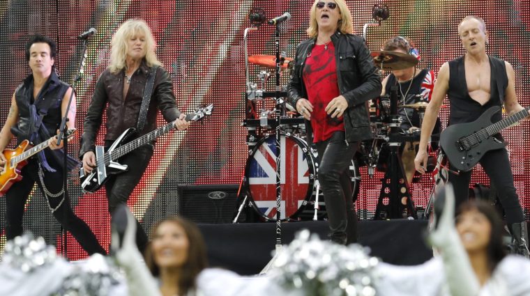 rock-band-def-leppard-performs-before-the-start-of-an-nfl-football-game-between-the-oakland-raiders-and-the-miami-dolphins-at-wembley-stadium-in-london