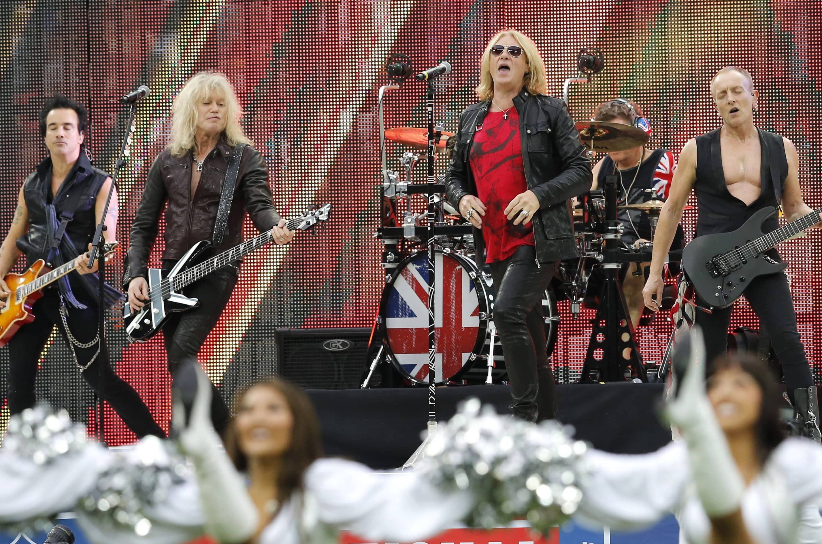 rock-band-def-leppard-performs-before-the-start-of-an-nfl-football-game-between-the-oakland-raiders-and-the-miami-dolphins-at-wembley-stadium-in-london