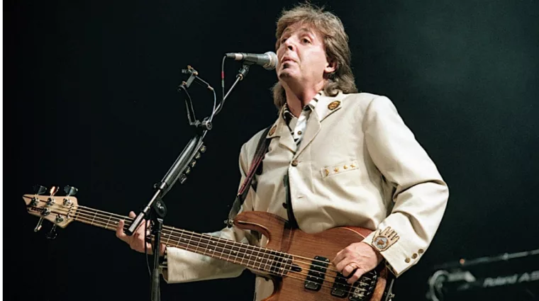 Paul McCartney performs at the Fourth of July concert in the Robert F. Kennedy football stadium. Washington DC. USA^ 4th July^ 1990