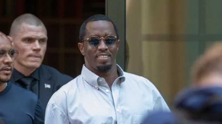 Sean “Diddy” Combs exiting the Crosby Street Hotel and heading to a waiting line of black SUV's. Lower Manhattan NYC^ New York / USA - July 24^ 2019