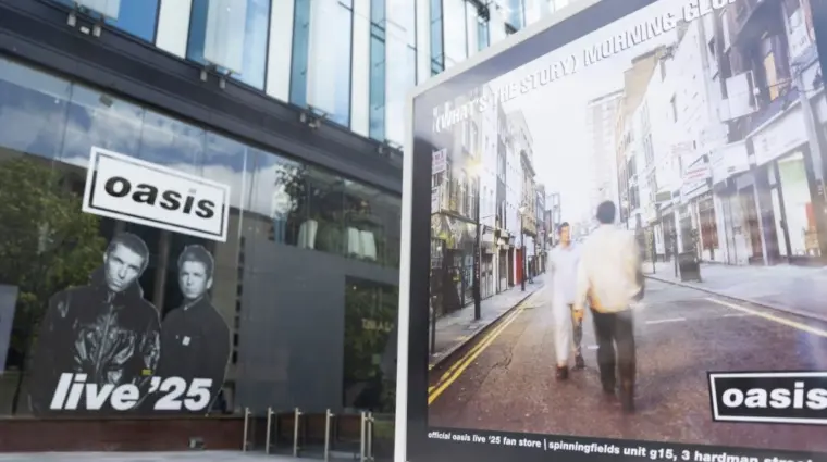 Oasis album cover artwork on display outside the Oasis live 25 shop in Manchester Manchester^ UK - 26 June 2025
