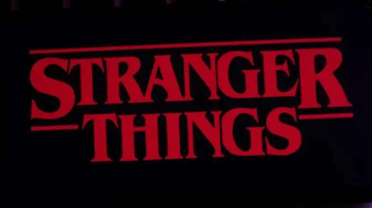 Iphone 11 pro with the Stranger Things logo on top of a computer keyboard. United States^ New York. Sunday^ September 29^ 2019.