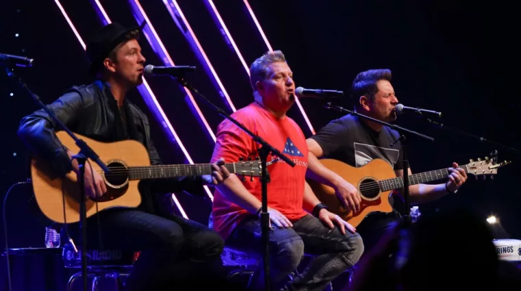 Joe Don Rooney^ Gary LeVox and Jay DeMarcus (L-R) of Rascal Flatts perform at CBS Radio's Stars & Stripes event at the Chicago Theatre on November 9^ 2016 in Chicago^ Illinois.