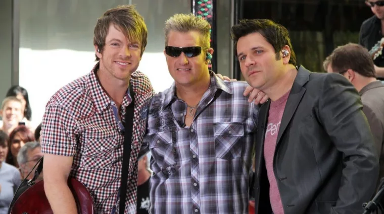 Guitarist Joe Don Rooney^ singer Gary Levox and bassist Jay DeMarcus of Rascal Flatts perform on NBC's Today Show in Rockefeller Plaza on June 11^ 2010 in New York City.